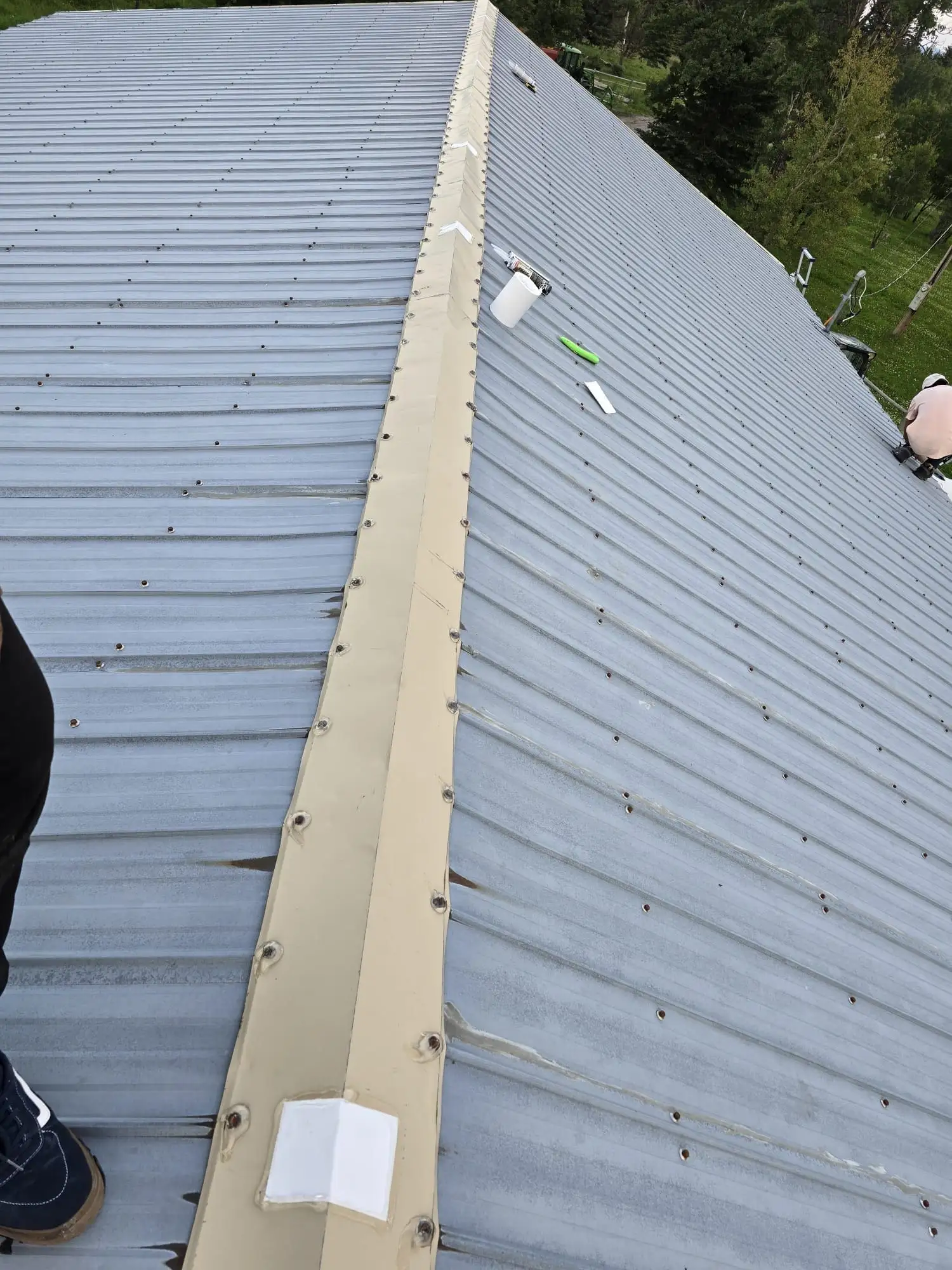 Close-up of a metal roof repair completed by Apex Roofing Repair