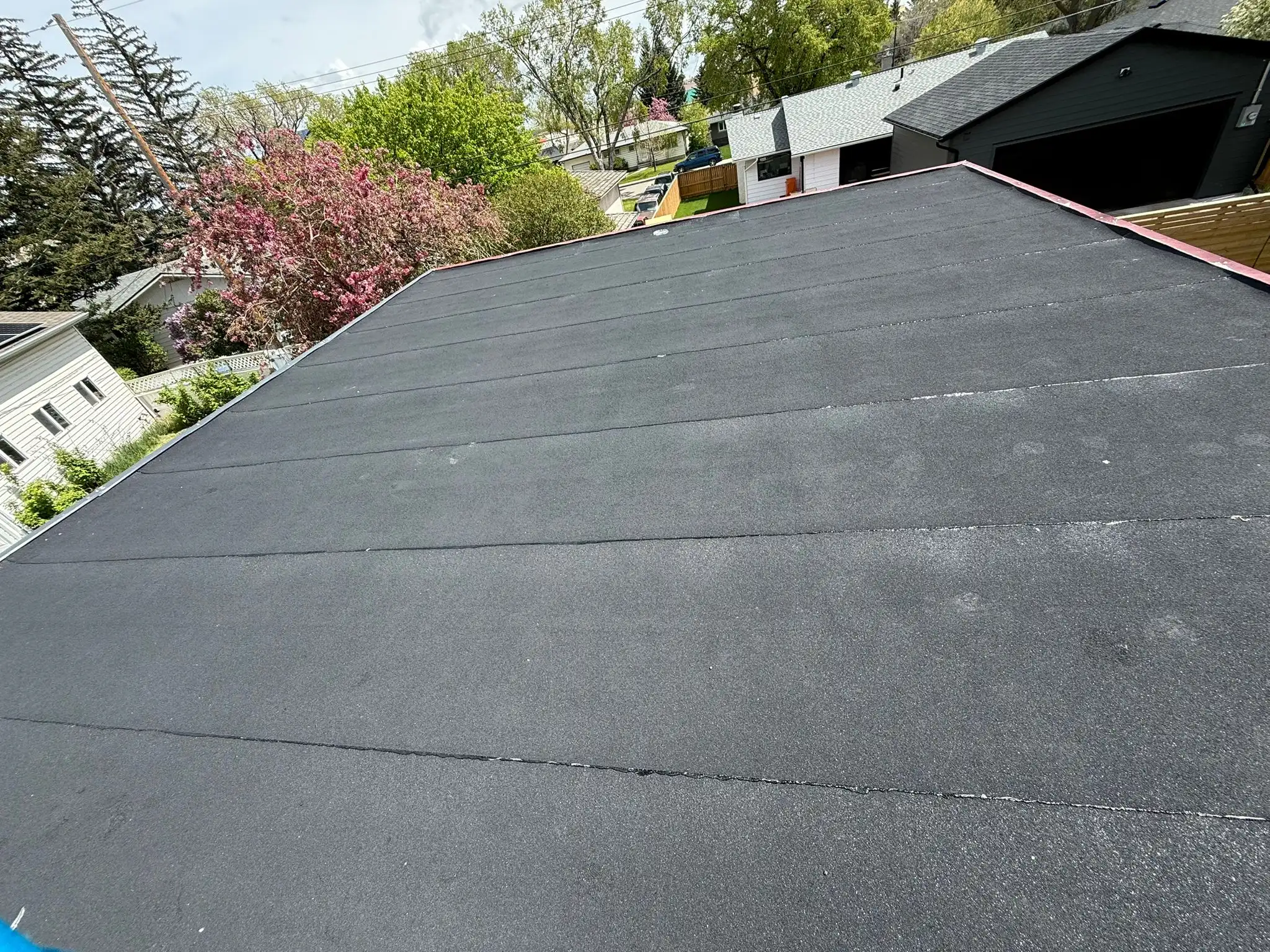 Finished torch-down SBS flat roof on a Calgary home