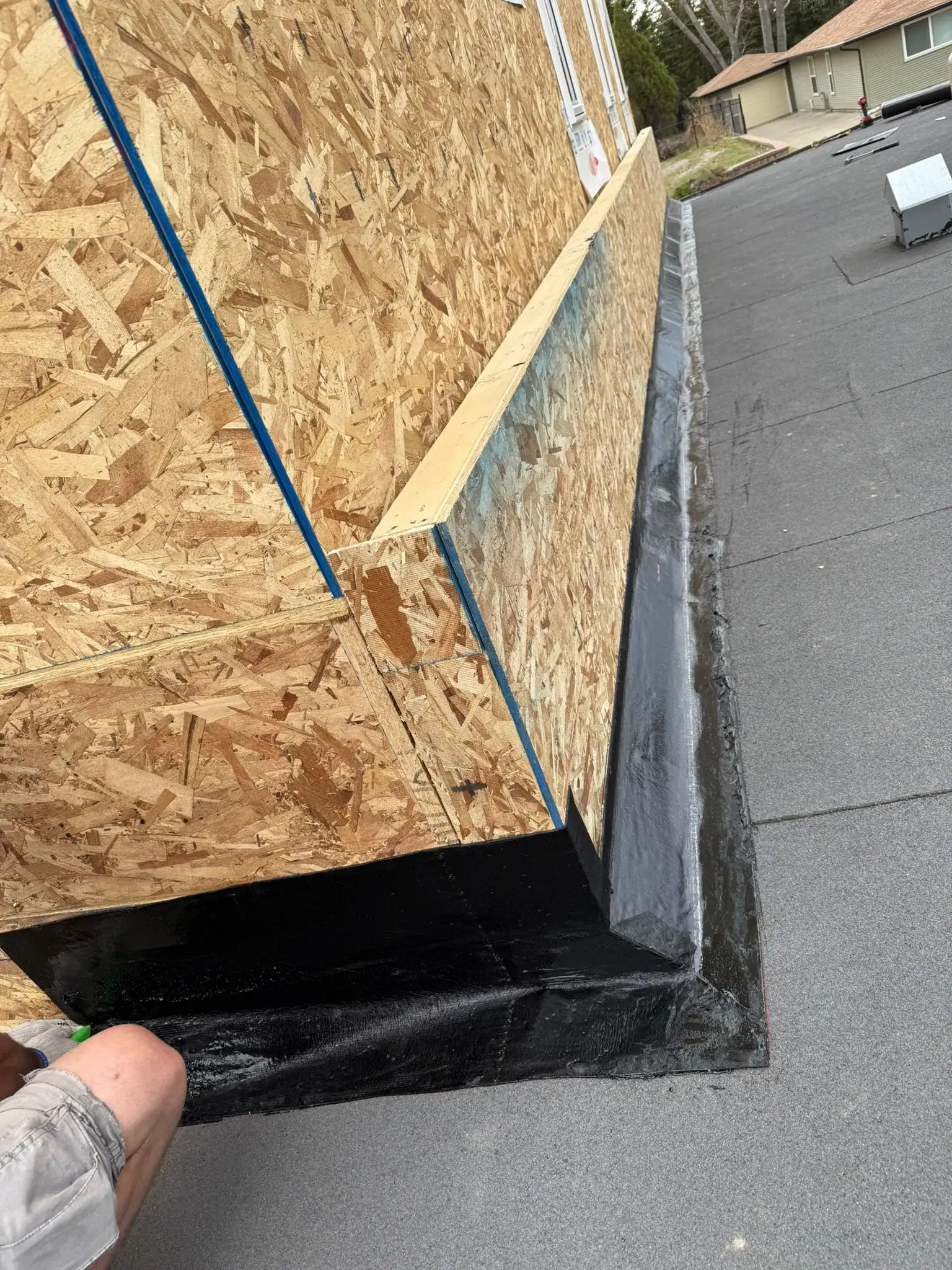 Weatherproofed SBS membrane seam detail at a wall transition on a Calgary flat roof